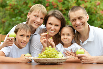  Family of five eating fruits 