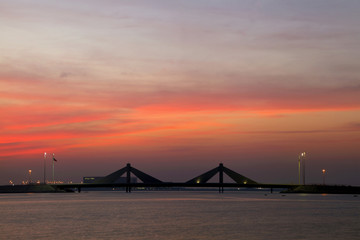 Fototapeta na wymiar Sheikh Isa Bin Salman causeway Bridge during sunset