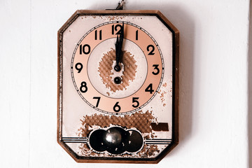 retro wall clock on old background