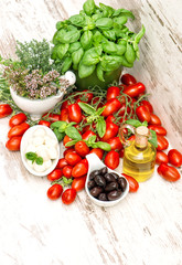 Fototapeta na wymiar Fresh herbs basil, tomatoes, mozzarella and olive oil. Healthy f