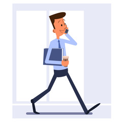Businessman walking, holding folder, talking on the phone
