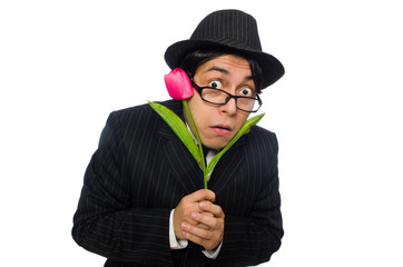 Young man in black costume with flower isolated on white