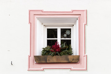 Squared glass window with pink frame and simple border with plan