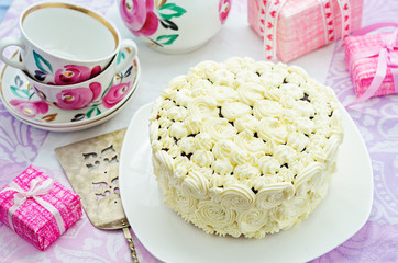 cake with vanilla cream in the form of roses