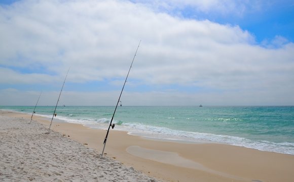 Fishing in Gulf of Mexico on white sand Florida Ocean Beaches