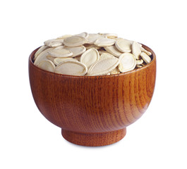 Pumpkin seeds in wooden bowl