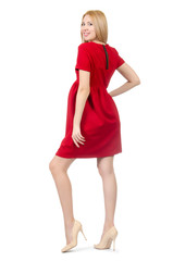 Pretty pregnant woman in red dress isolated on white