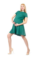 Beautiful pregnant woman in green dress isolated on white