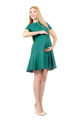 Beautiful pregnant woman in green dress isolated on white