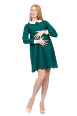Beautiful pregnant woman in green dress isolated on white