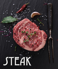 Raw beef steak onblack table