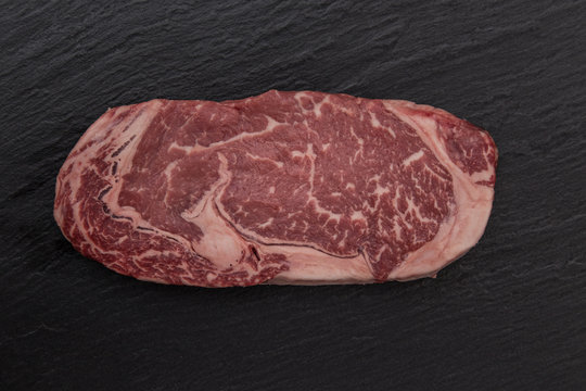 Raw beef steak onblack table