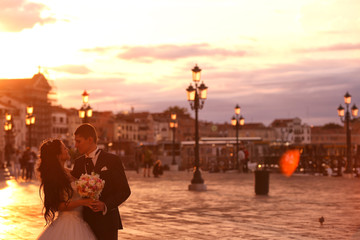 Bridel couple in Venice at sunset
