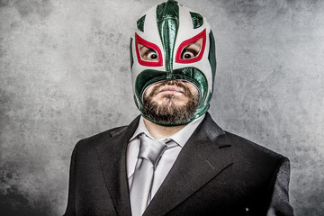businessman angry with Mexican wrestler mask