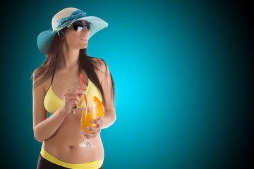 Young sexy brunette in yellow swimsuit