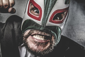 businessman angry with Mexican wrestler mask - obrazy, fototapety, plakaty