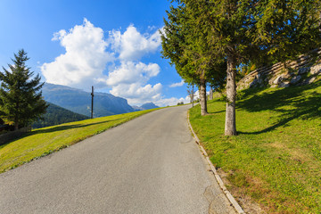 Fototapeta na wymiar Road in San Cassiano alpine village, Dolomites Mountains, Italy