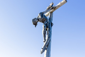 the crucifixion of Jesus Christ on top of the dolomites alps