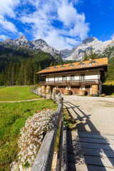 Stable in green alpine valley in Dolomites Mountains, Italy
