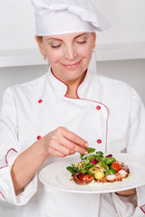 Chef-cook presenting meals