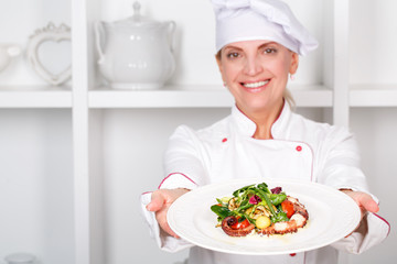 Chef-cook presenting meals