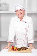 Chef-cook presenting meals