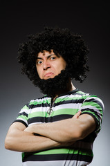 Fototapeta na wymiar Funny man with afro hairstyle isolated on white