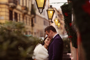Bride and groom under lamp