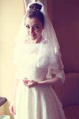 Beautiful bride in wedding dress with veil