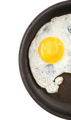Fried egg in a frying pan over white background