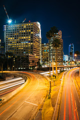 Fototapeta na wymiar Traffic on the 110 Freeway and buildings in Los Angeles at night