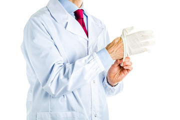 Doctor in white coat wearing disposable latex gloves