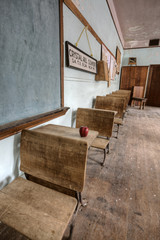 Obraz na płótnie Canvas Abandoned School House red apple