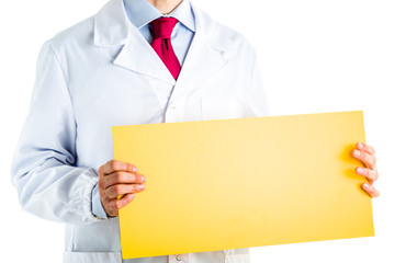Doctor in white coat showing a yellow signboard