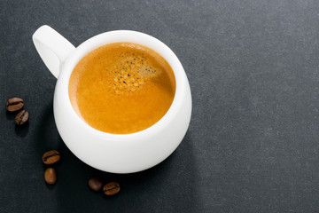 espresso on a dark background and space for your text, top view