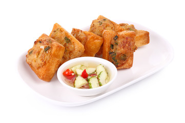 Fried bread with minced pork spread (Thai food) on white plate