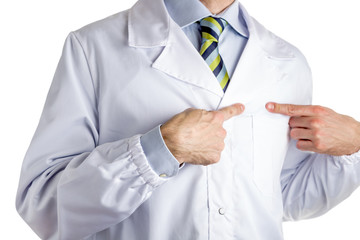 Man in medical coat pointing to his heart with forefingers
