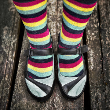 Female Legs In Striped Socks In Vintage Style