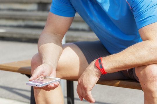 athlete checking fitness data wearable
