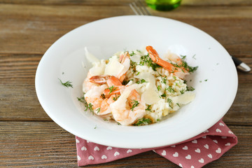 Rice with shrimp and dill on a plate