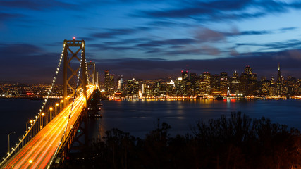 San Francisco Bay Bridge and skyline at night