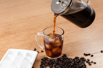 Pouring Coffee Onto Ice