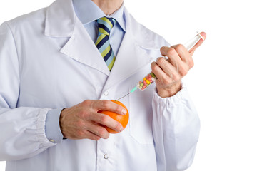 man in medical white coat makes an injection to orange