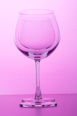 Empty wine glass. isolated on pink background