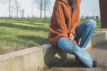 Detail of a girl posing in an urban context