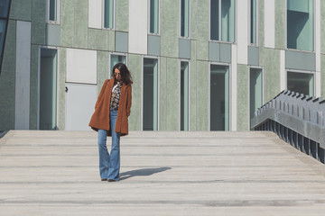 Beautiful girl posing in an urban context