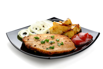 Roasted steak with baked potatoes, onion and ketchup