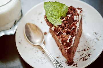 Delicious chocolate cake on plate on table