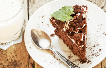Delicious chocolate cake on plate on table