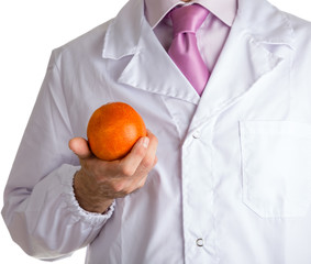 man in medical white coat showing an orange